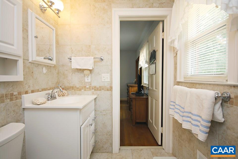 2709 Northfield Road Charlottesville, VA 22901 - Photo 16 of 32 a bathroom with a sink and a mirror