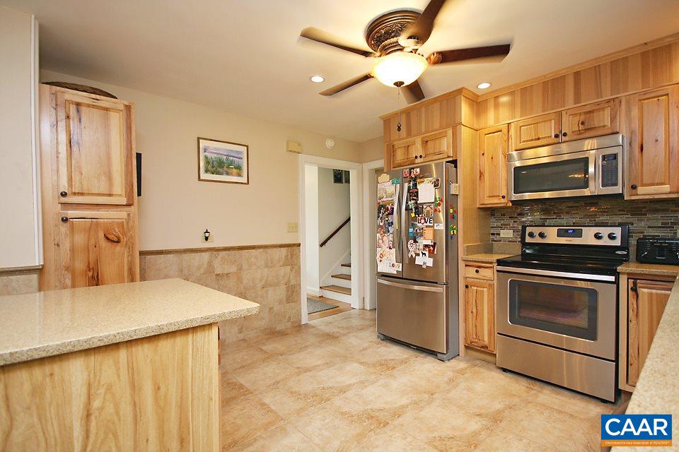2709 Northfield Road Charlottesville, VA 22901 - Photo 8 of 32 a kitchen with stainless steel appliances granite countertop a refrigerator a stove and a sink with cabinets