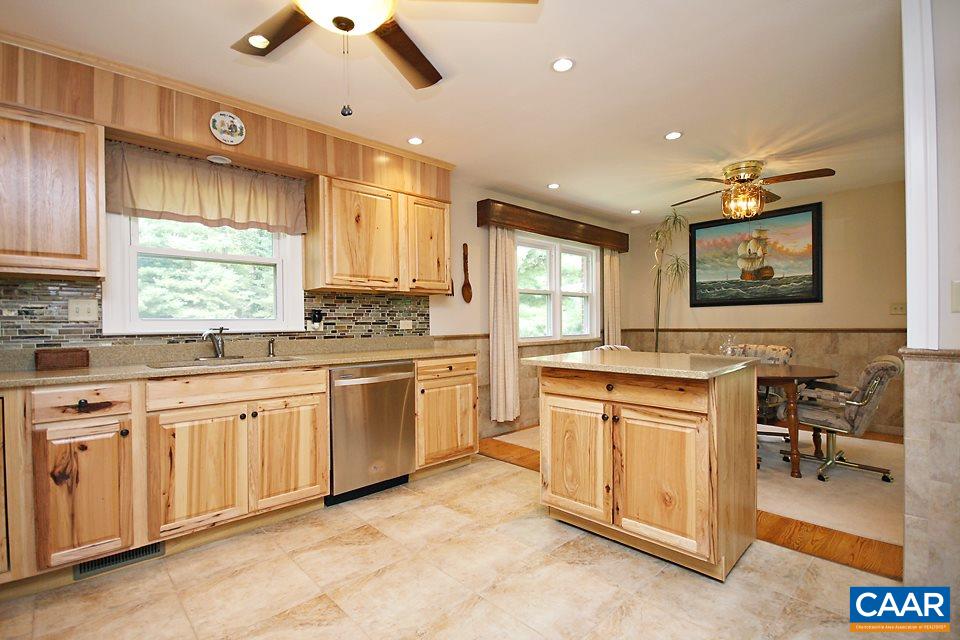 2709 Northfield Road Charlottesville, VA 22901 - Photo 9 of 32 a kitchen with a stove a sink and a refrigerator