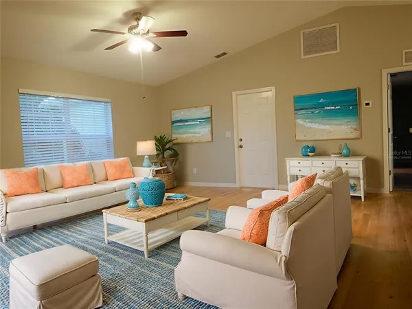 a view of a kitchen with a sink and refrigerator