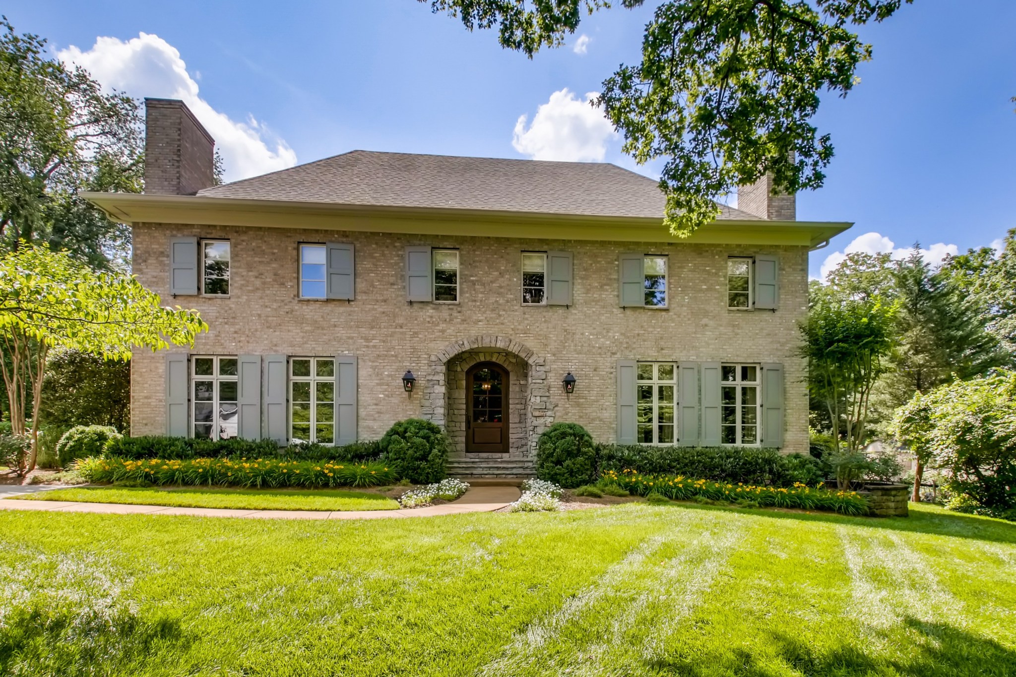 a front view of a house with a yard