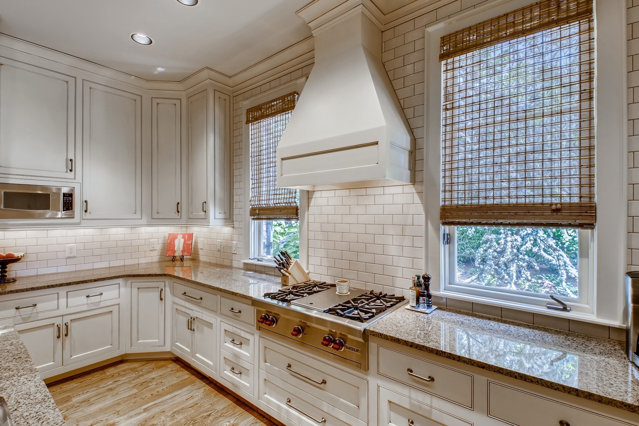 3919 Dorcas Drive Nashville, TN 37215 - Photo 12 of 40 a kitchen with a stove a sink and wooden floor