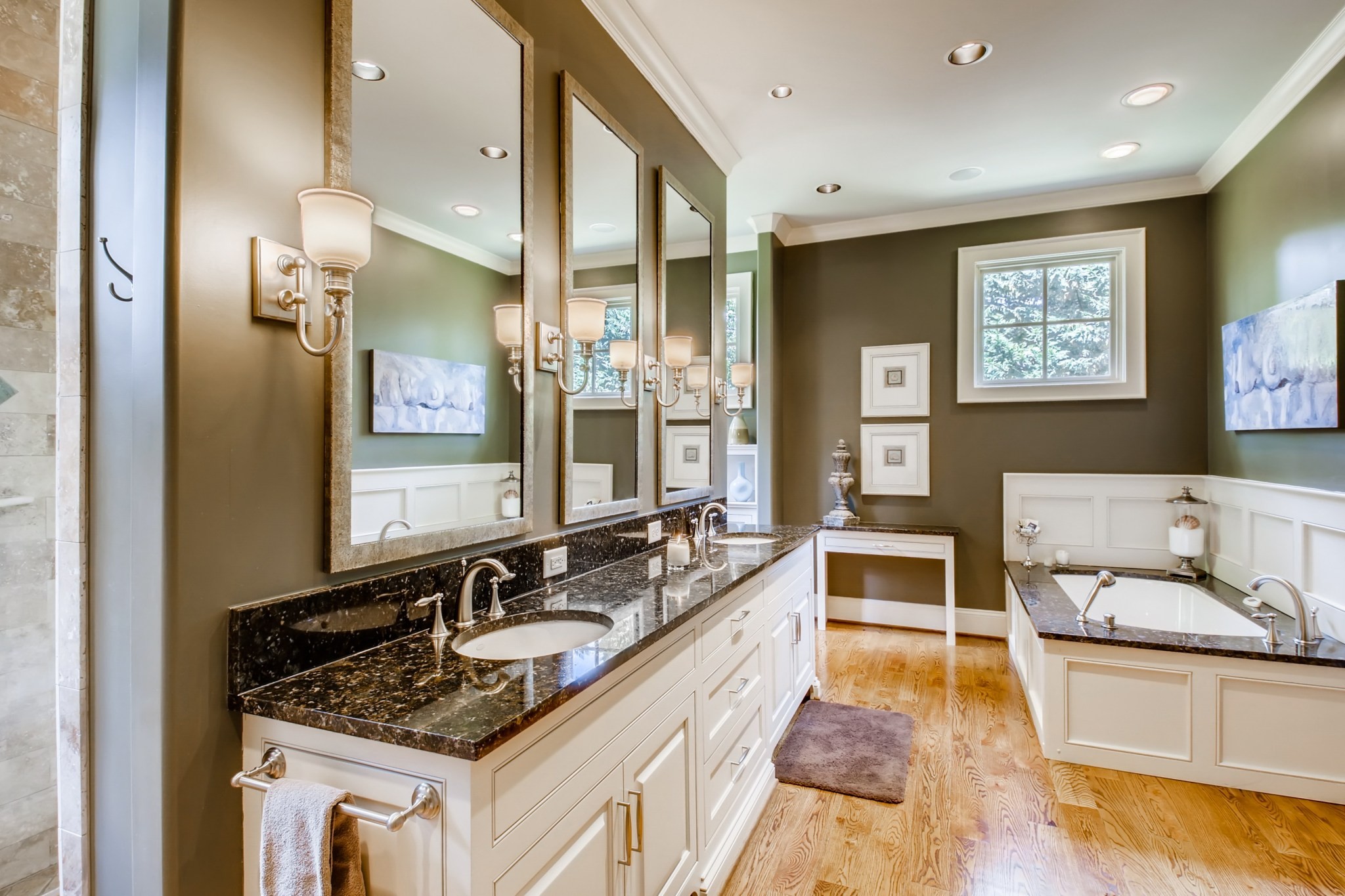 3919 Dorcas Drive Nashville, TN 37215 - Photo 21 of 40 a spacious bathroom with a granite countertop tub a double vanity sink and a mirror