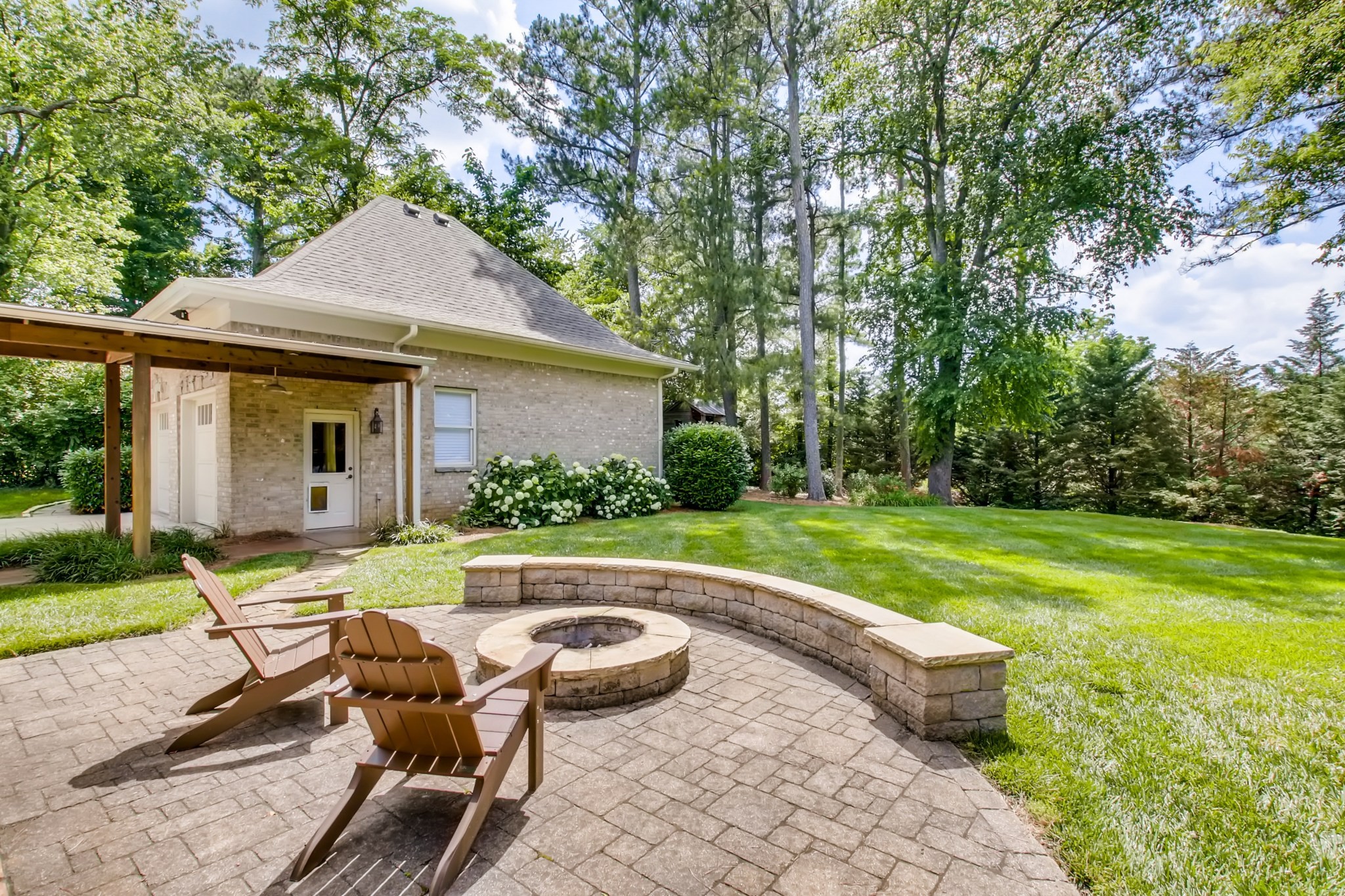 3919 Dorcas Drive Nashville, TN 37215 - Photo 35 of 40 a view of a house with backyard sitting area and garden