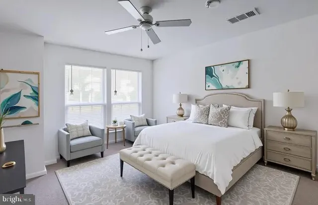 a view of a chair and tables in the balcony