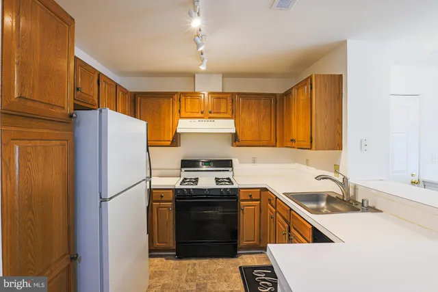a bedroom with a bed table and a window