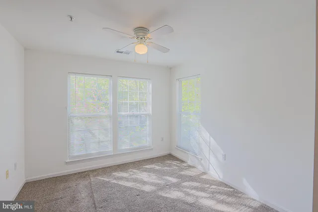 a bathroom with a sink a toilet and a large mirror