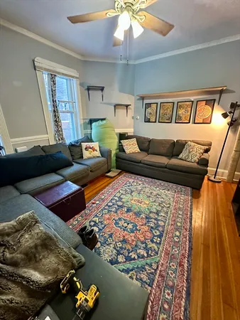 a living room with furniture and a rug
