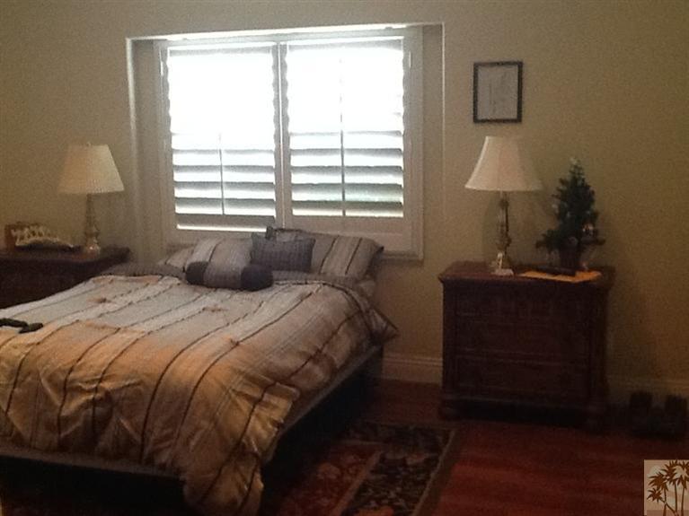 71936 Vista Del Rio Rancho Mirage, CA 92270 - Photo 15 of 17 a bedroom with a bed and a window
