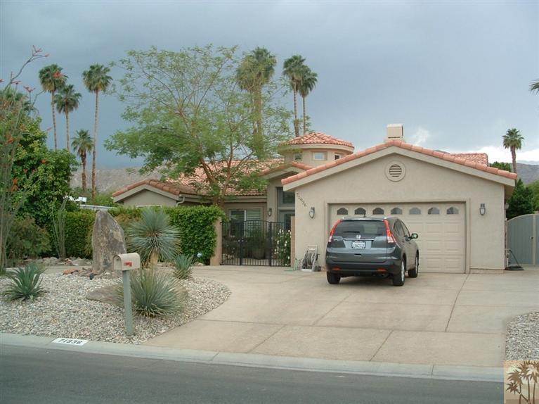 71936 Vista Del Rio Rancho Mirage, CA 92270 - Photo 3 of 17 a car parked in front of house
