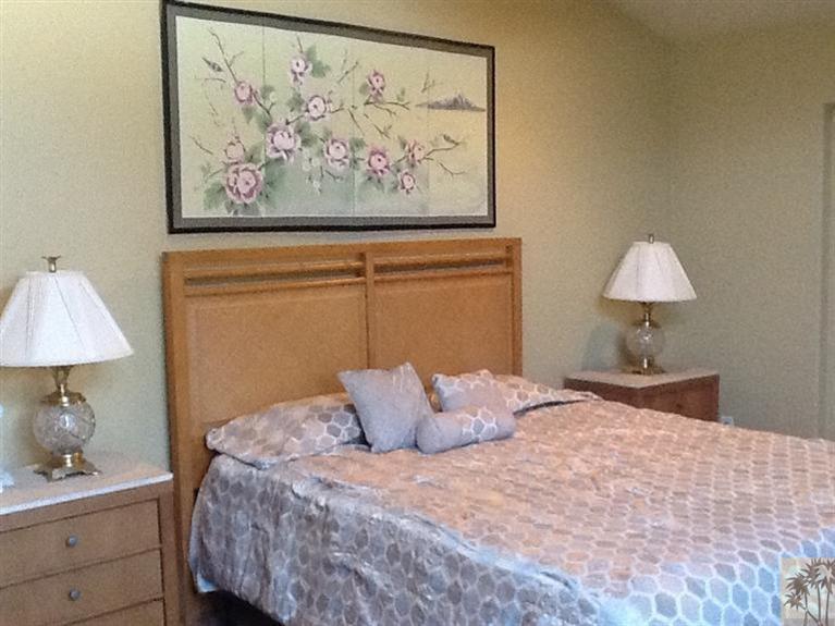 71936 Vista Del Rio Rancho Mirage, CA 92270 - Photo 6 of 17 a bedroom with a bed and a lamp on dresser