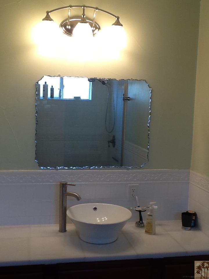 71936 Vista Del Rio Rancho Mirage, CA 92270 - Photo 9 of 17 a bathroom with a sink and a mirror
