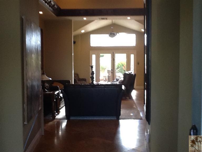 71936 Vista Del Rio Rancho Mirage, CA 92270 - Photo 10 of 17 a living room with furniture and a chandelier