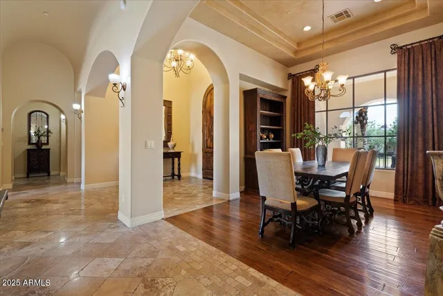 a kitchen with kitchen island granite countertop a stove and a sink