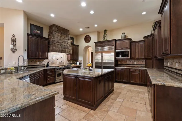 a bedroom with a bed and dresser with window