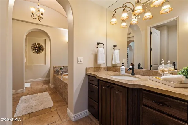 a kitchen with a refrigerator and a sink