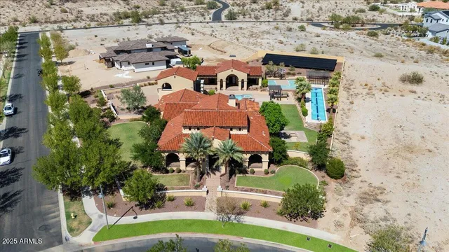 a view of a house with swimming pool and sitting area