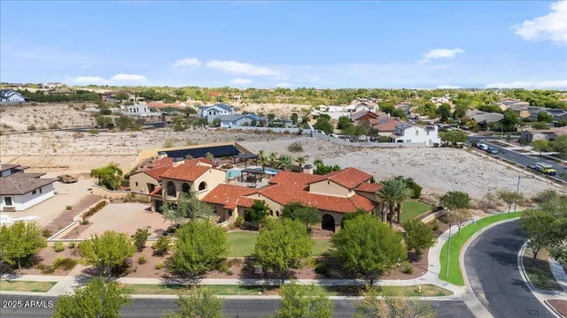 a front view of a house with yard and green space