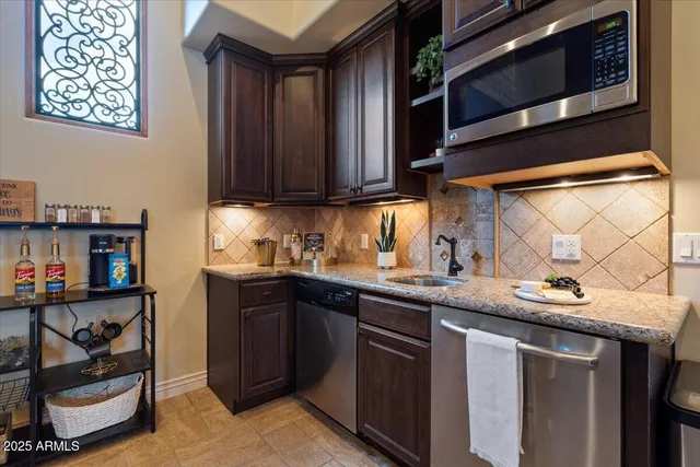 a outdoor space with lots of furniture and a fireplace