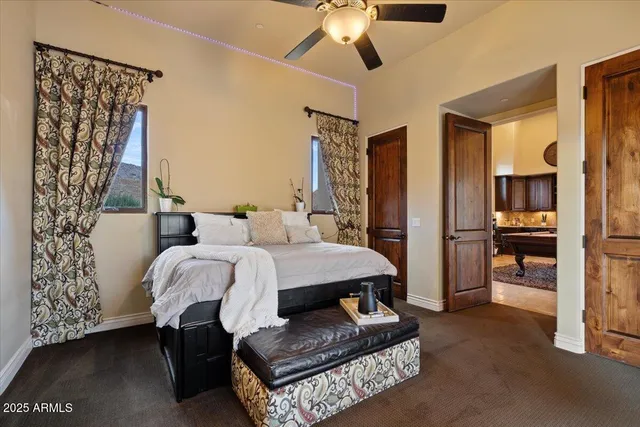 an aerial view of a house with a mountain