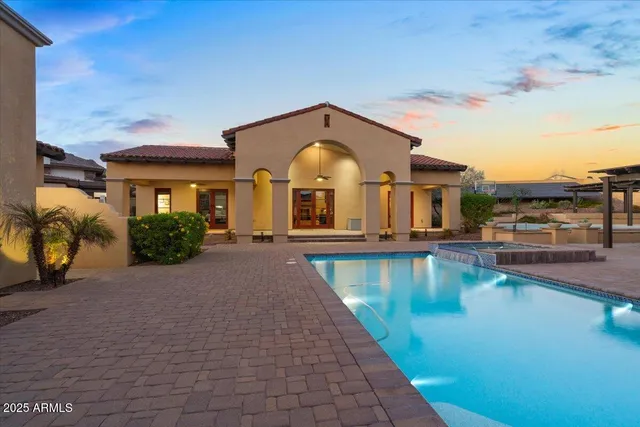 a view of a house with swimming pool