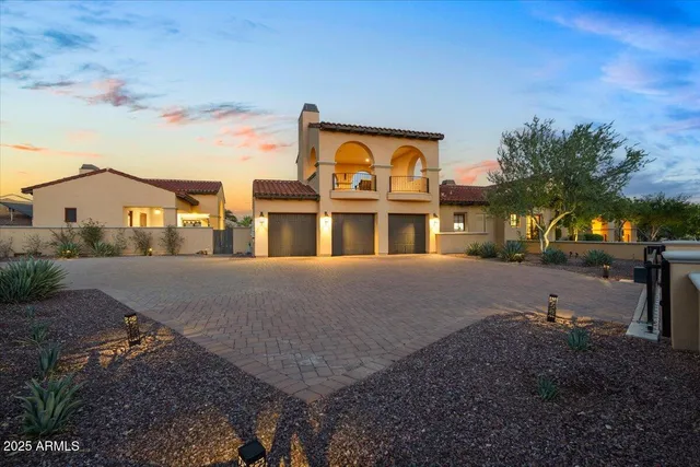 a living room with furniture a fireplace and a table