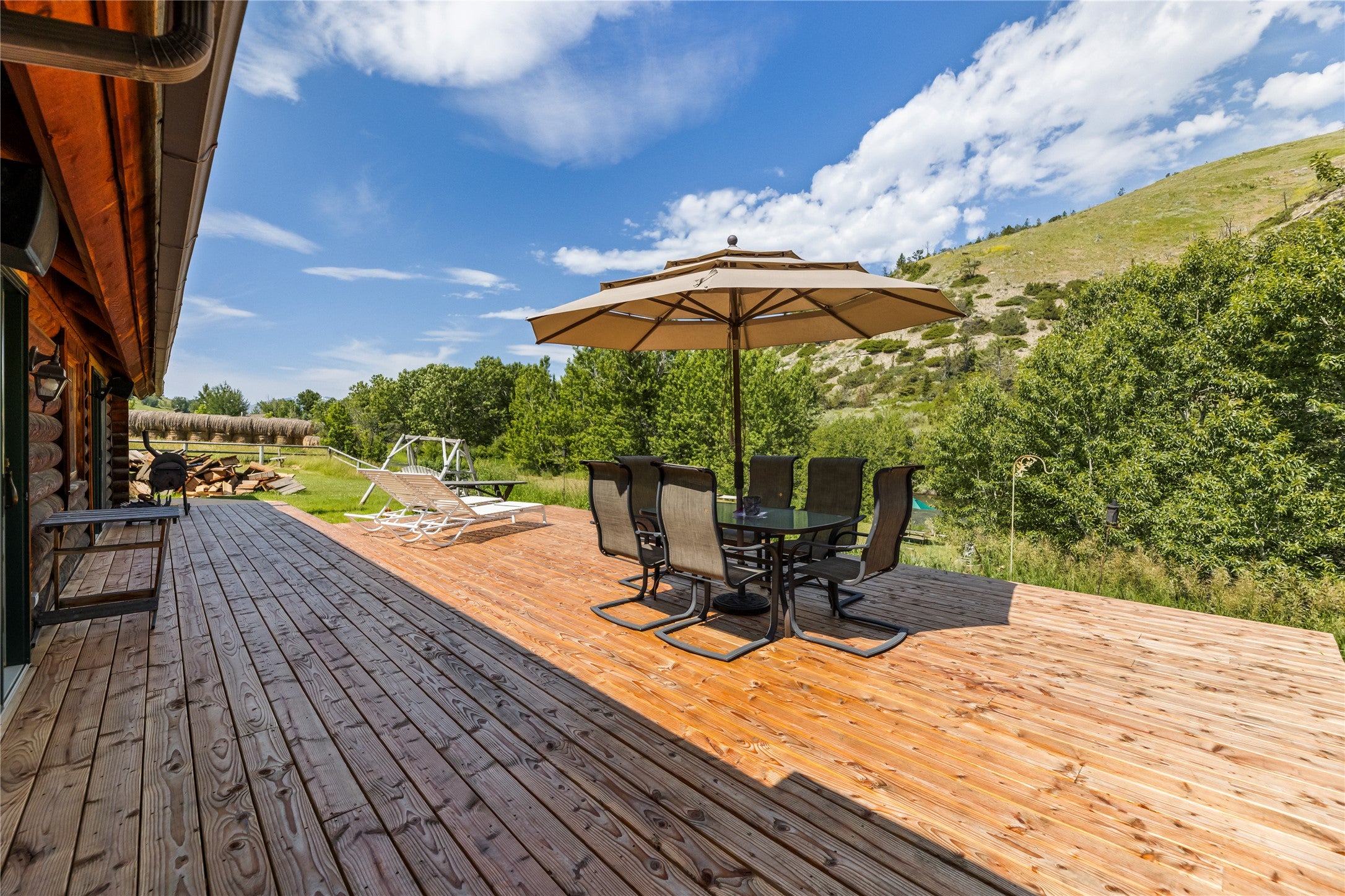 380 West Boulder Road McLeod, MT 59052 - Photo 34 of 77 New wooden deck featuring outdoor dining space