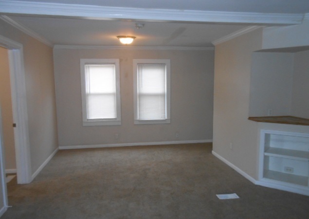 1014 Nicholson Street Joliet, IL 60435 - Photo 5 of 9 a view of an empty room with a window