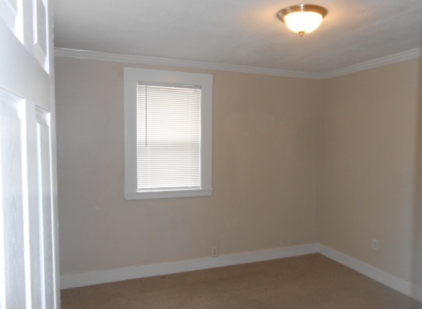 1014 Nicholson Street Joliet, IL 60435 - Photo 7 of 9 an empty room with a window