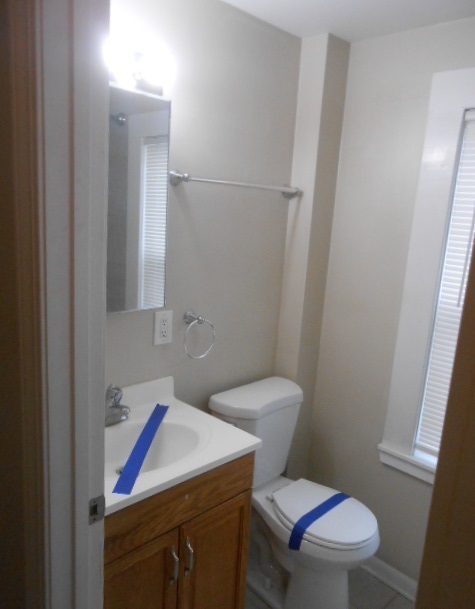 1014 Nicholson Street Joliet, IL 60435 - Photo 8 of 9 a bathroom with a toilet and a sink
