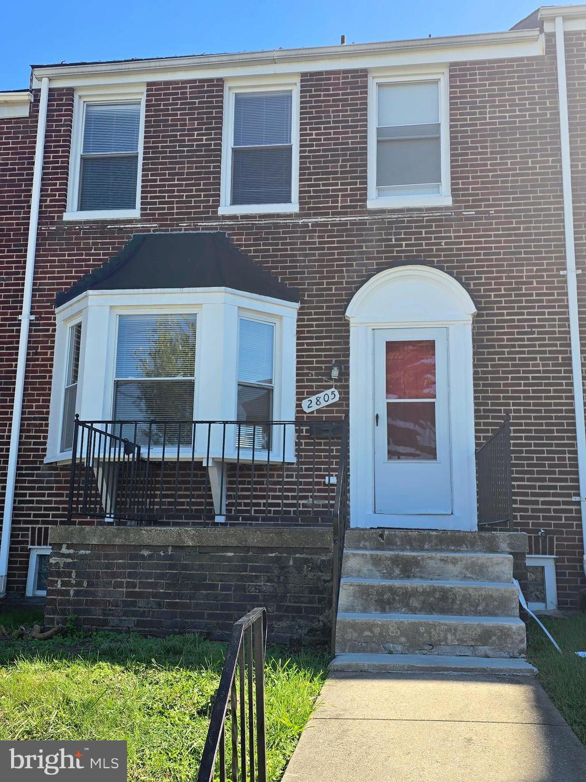 2805 Edison Highway Baltimore, MD 21213 - Photo 1 of 28 a front view of a house with a yard