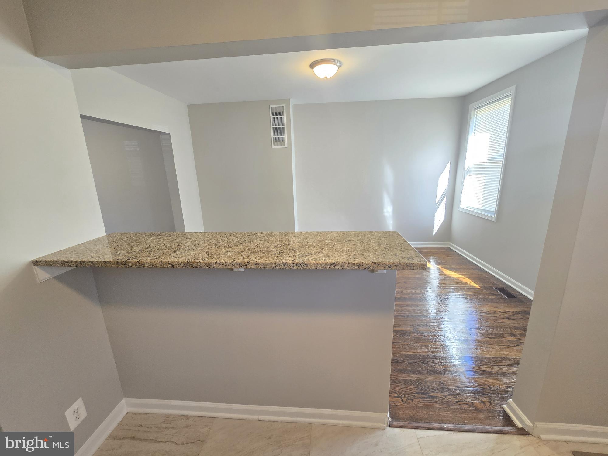 2805 Edison Highway Baltimore, MD 21213 - Photo 11 of 28 a bathroom with a sink and a mirror