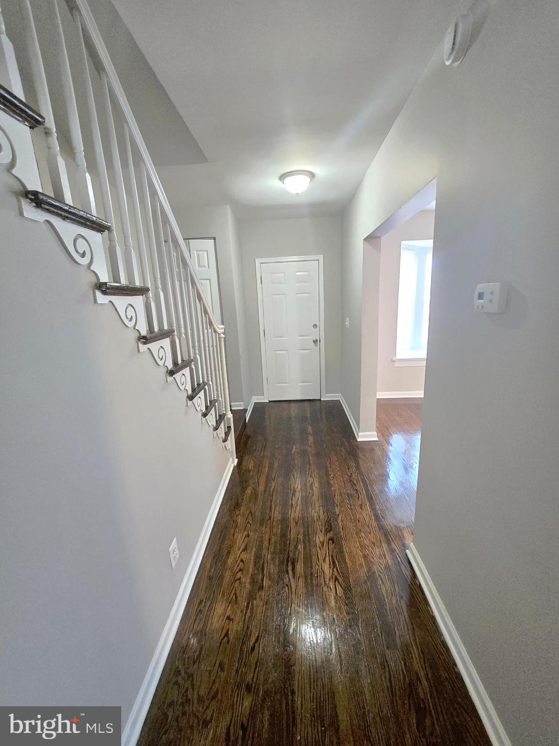 2805 Edison Highway Baltimore, MD 21213 - Photo 12 of 28 a view of a hallway with wooden floor