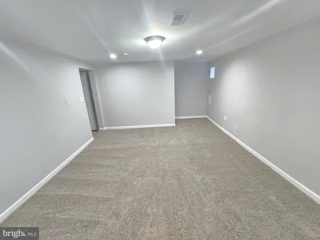 a bathroom with a white bath tub and a shower
