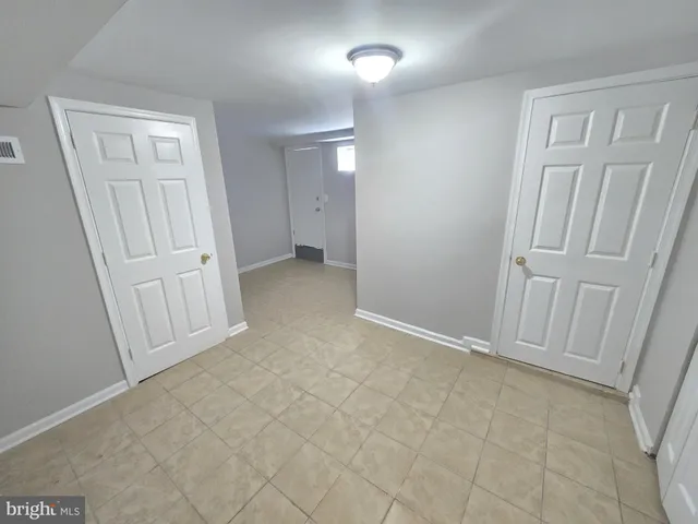 a white toilet sitting next to a white sink