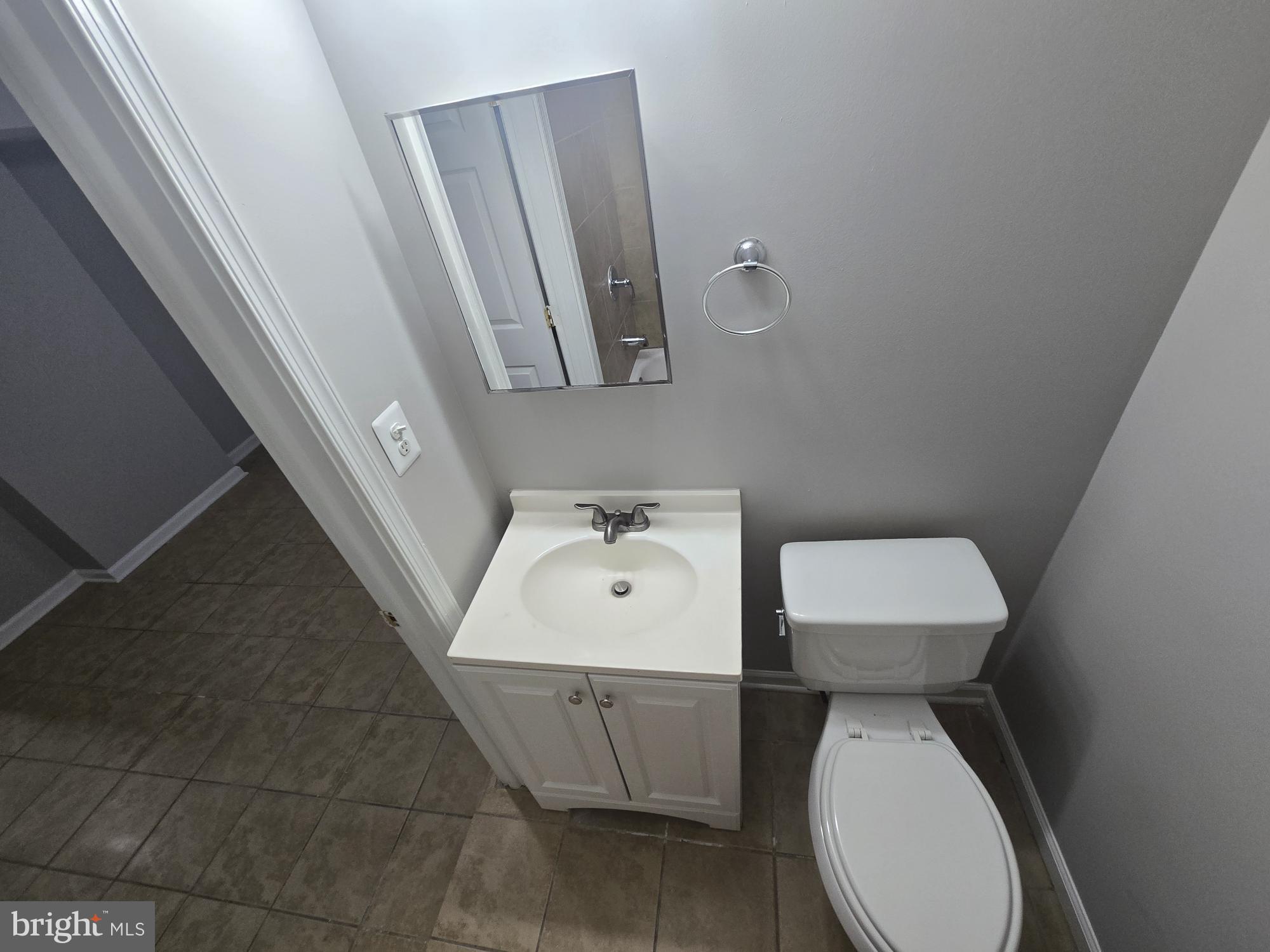 2805 Edison Highway Baltimore, MD 21213 - Photo 25 of 28 a white toilet sitting next to a white sink