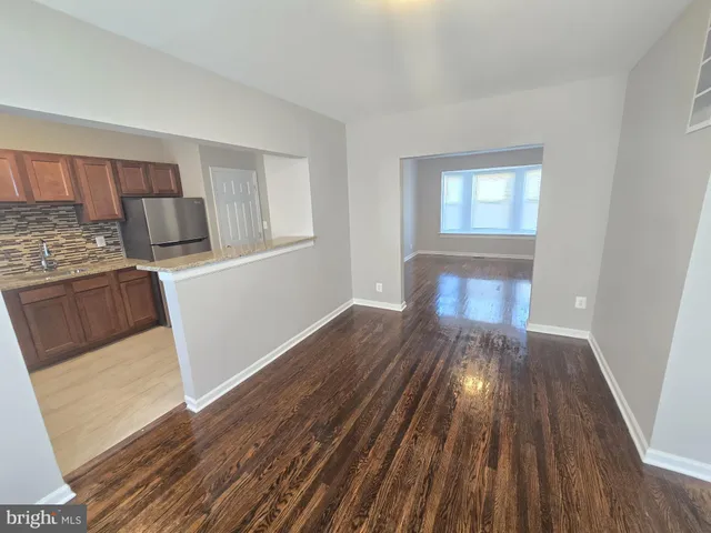 a view of a kitchen from the hallway
