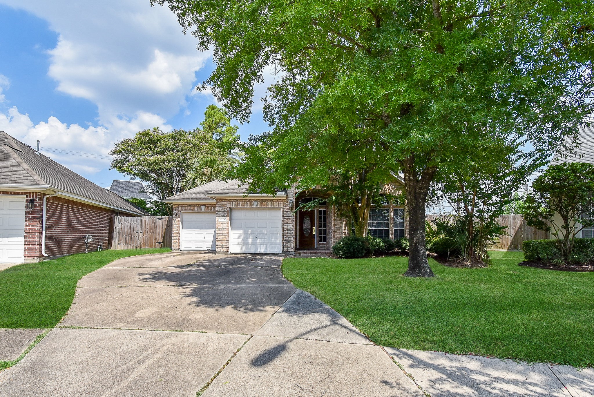 1714 Wellington Way Houston, TX 77055 - Photo 1 of 20 a front view of a house with garden