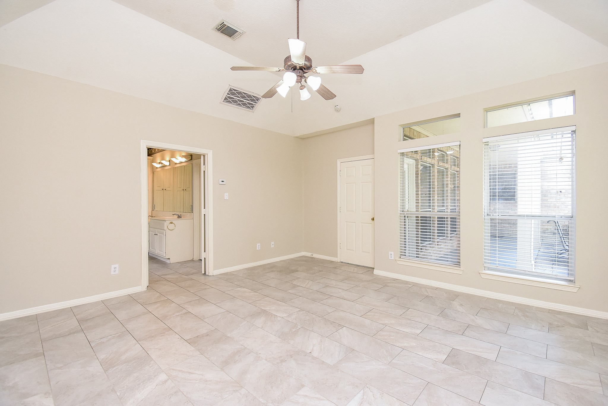 1714 Wellington Way Houston, TX 77055 - Photo 10 of 20 a view of an empty room with a window