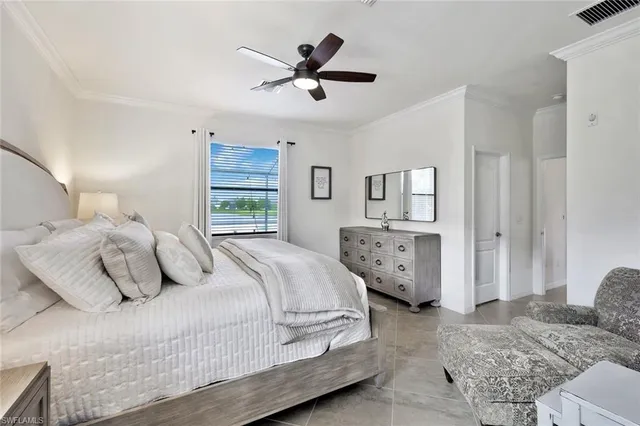 a spacious bathroom with a double vanity sink a large mirror and a bathtub