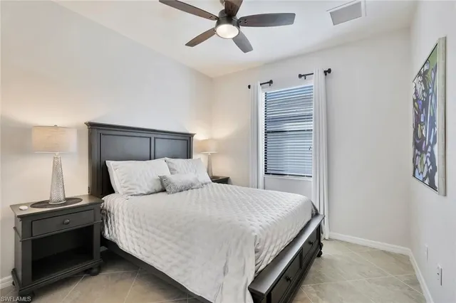 a bathroom with a sink a toilet a mirror a vanity and bathtub