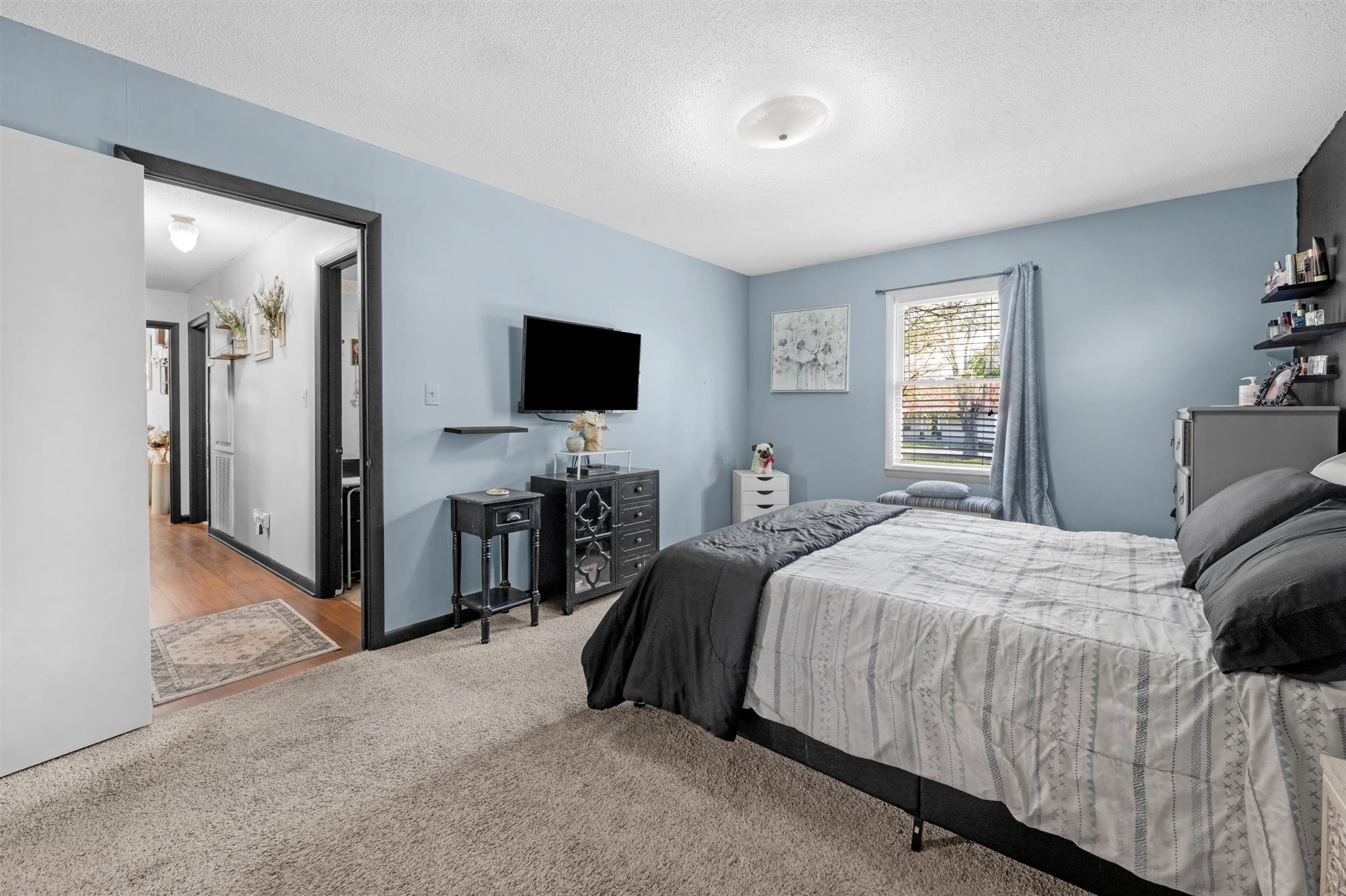 601 Courthouse View Street Lafayette, TN 37083 - Photo 12 of 25 a bedroom with a bed and a flat screen tv