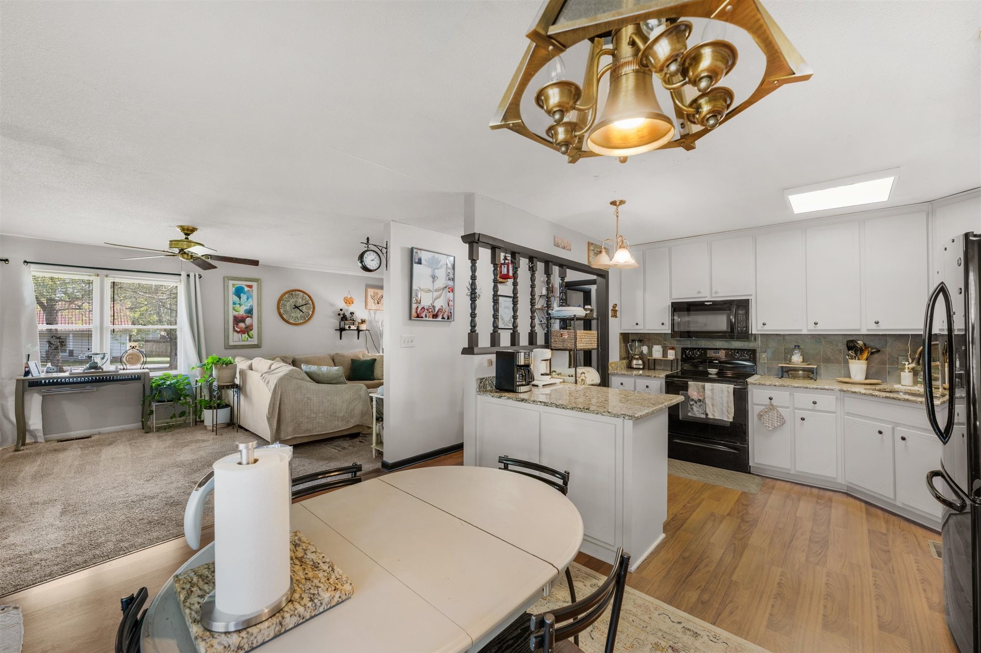 601 Courthouse View Street Lafayette, TN 37083 - Photo 17 of 25 a kitchen with a table chairs stove and cabinets