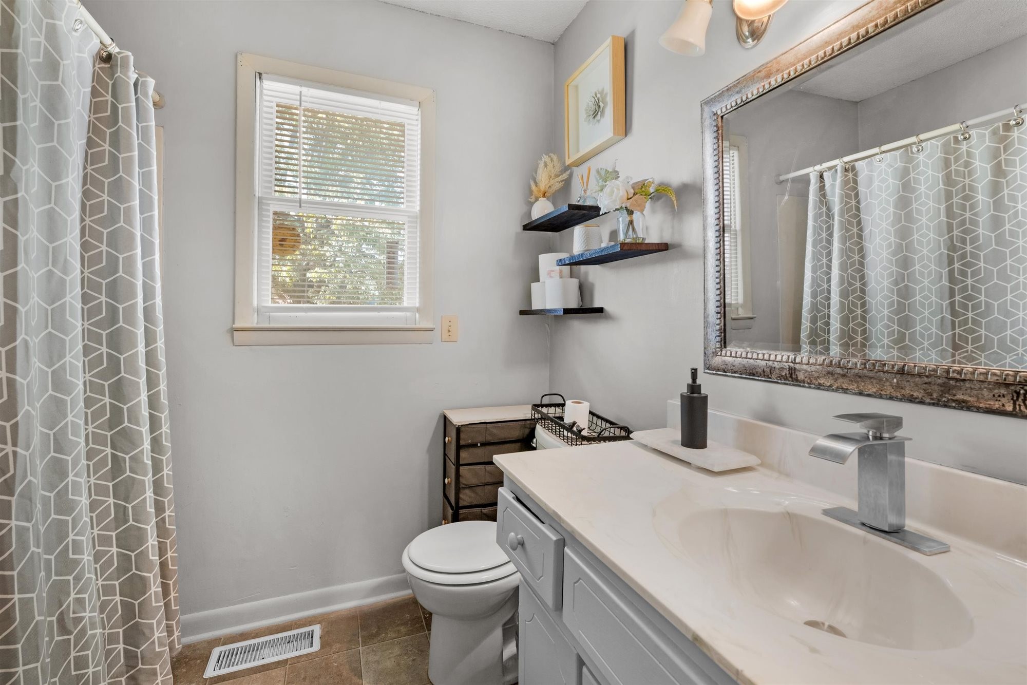 601 Courthouse View Street Lafayette, TN 37083 - Photo 22 of 25 a bathroom with a sink toilet and window