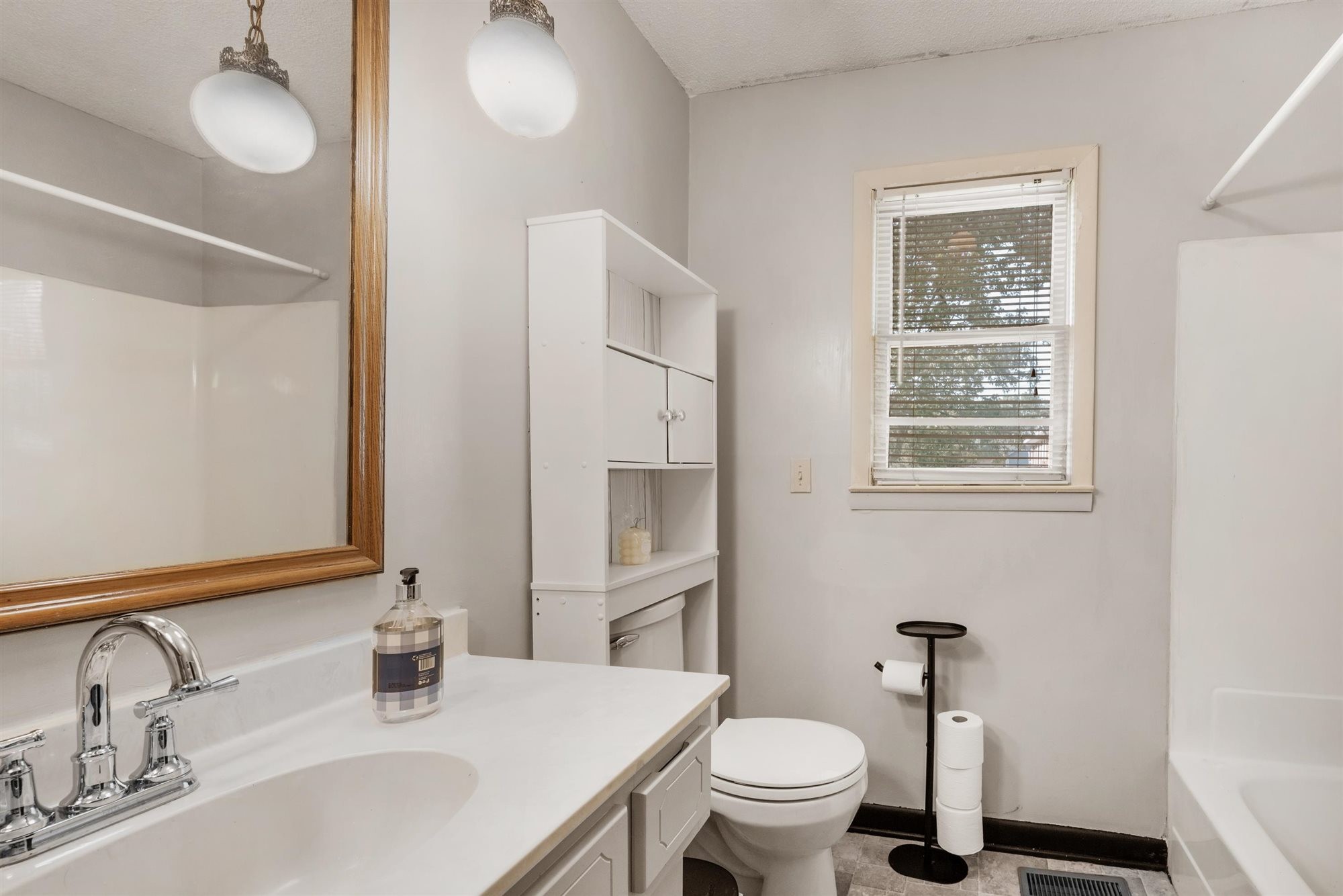 601 Courthouse View Street Lafayette, TN 37083 - Photo 7 of 25 a bathroom with a sink toilet and a mirror