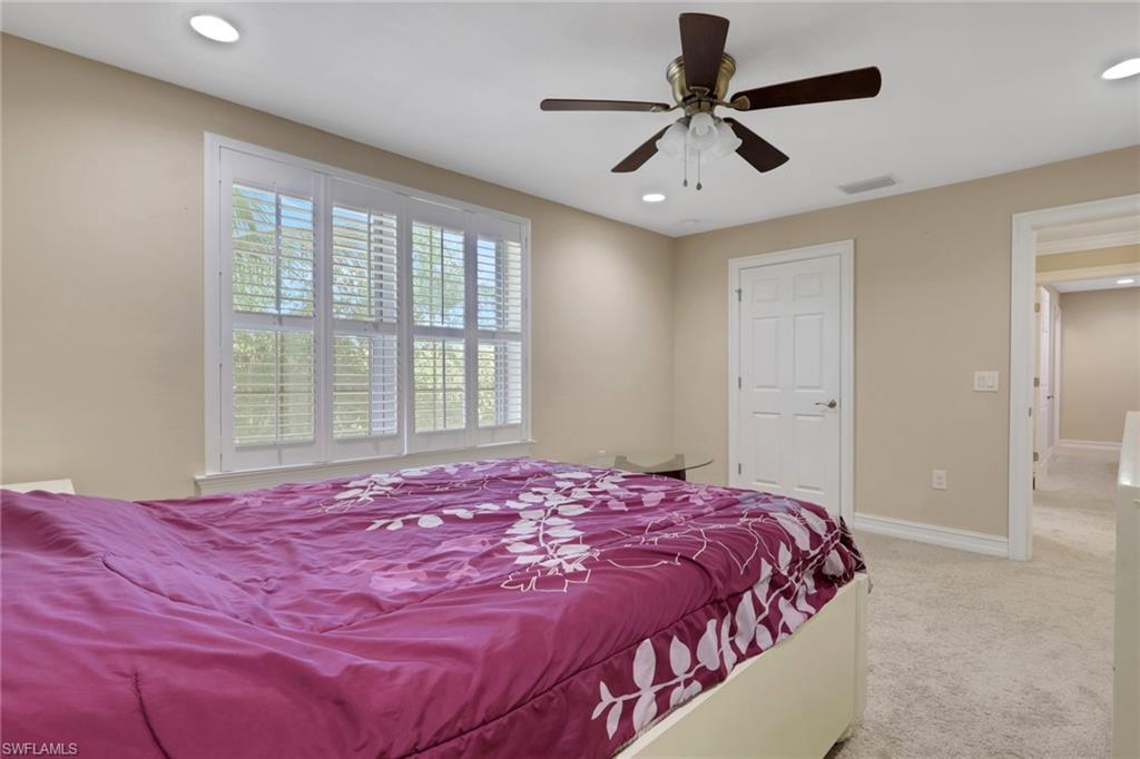 16309 Aberdeen Way Naples, FL 34110 - Photo 21 of 34 a bedroom with a bed and a window