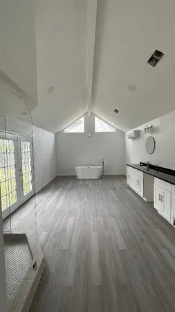 a bathroom with a glass shower door