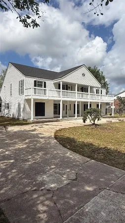 a view of a backyard with a lake view