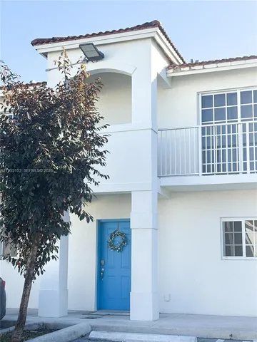 a view of a house with a window and wooden floor