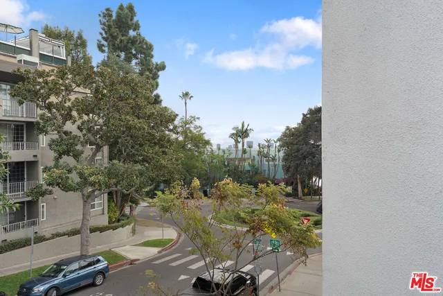a view of backyard with swimming pool and outdoor seating